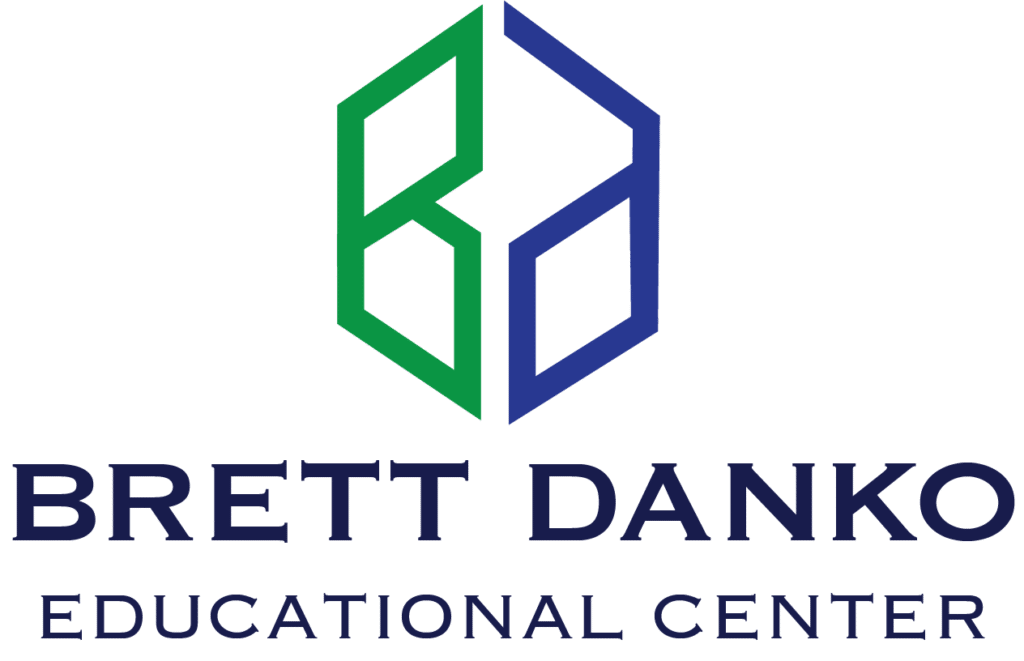 Logo for Brett Danko Educational Center featuring a geometric design in green and blue above the center's name in bold letters.
