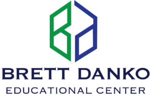 Logo for Brett Danko Educational Center featuring a geometric design in green and blue above the center's name in bold letters.